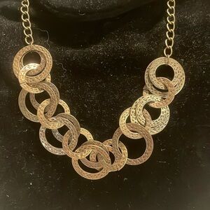 18" hammered antique brass necklace w/20 intertwined open hoop pendants